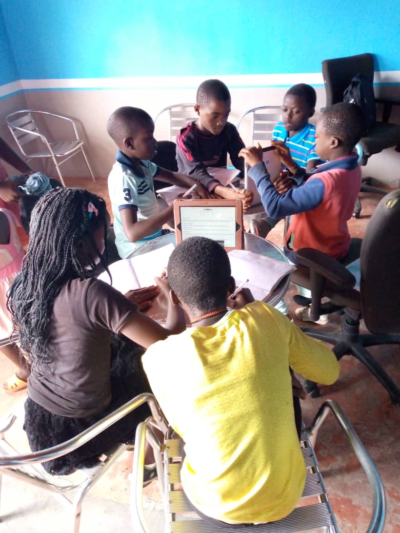 A group of children sitting at desks in a classroom

Description automatically generated with medium confidence